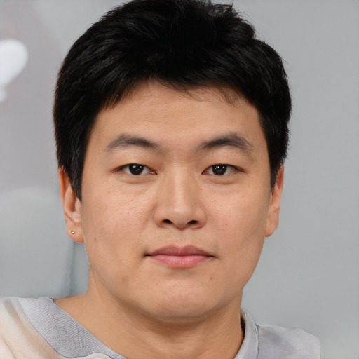 Neutral asian young-adult male with short  brown hair and brown eyes