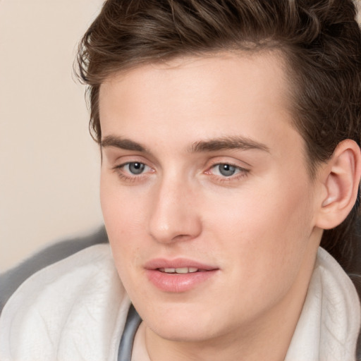 Joyful white young-adult male with medium  brown hair and brown eyes