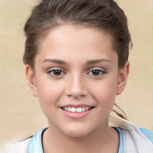 Joyful white child female with short  brown hair and brown eyes