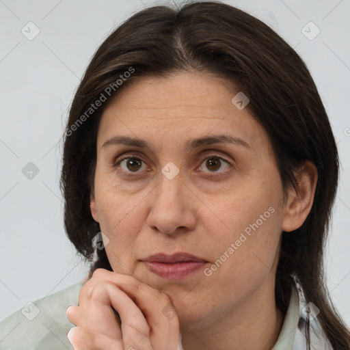 Joyful white adult female with medium  brown hair and brown eyes