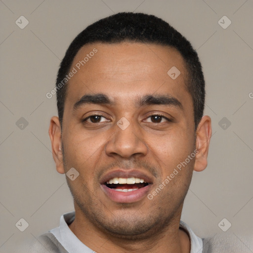 Joyful black young-adult male with short  black hair and brown eyes