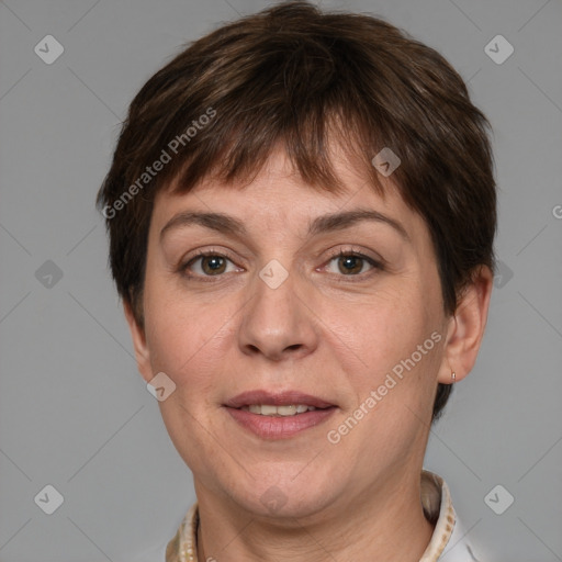 Joyful white adult female with short  brown hair and brown eyes