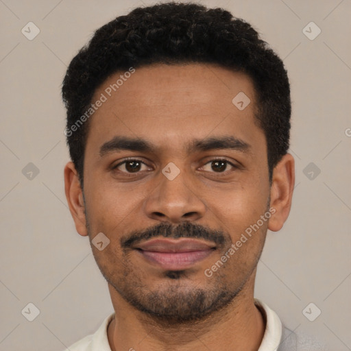 Joyful black young-adult male with short  black hair and brown eyes
