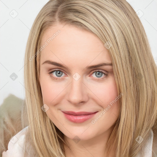 Joyful white young-adult female with long  brown hair and blue eyes