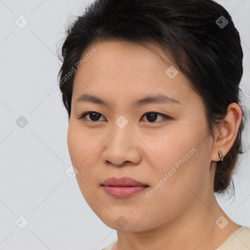 Joyful asian young-adult female with medium  brown hair and brown eyes