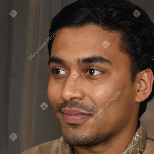 Joyful latino young-adult male with short  black hair and brown eyes