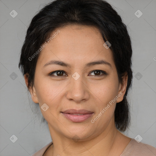 Joyful latino adult female with medium  brown hair and brown eyes