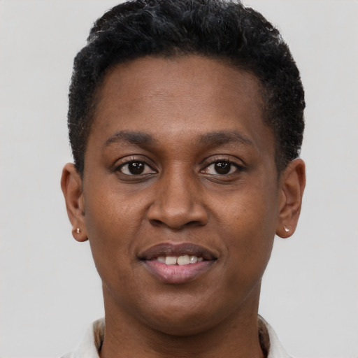 Joyful black young-adult male with short  brown hair and brown eyes