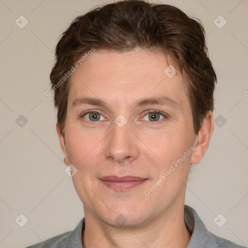 Joyful white adult male with short  brown hair and brown eyes