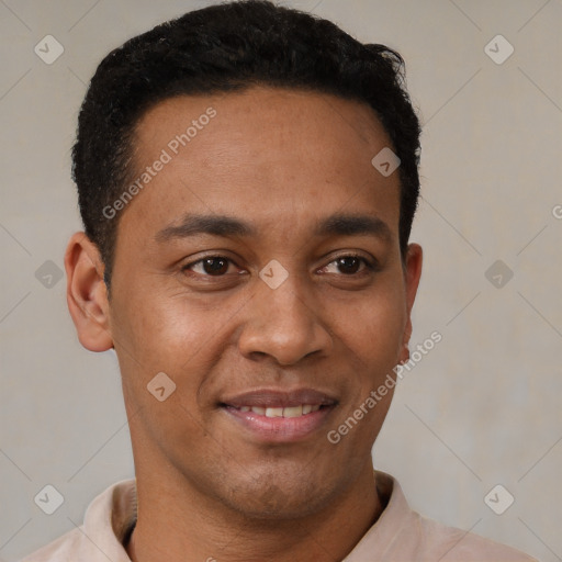 Joyful latino young-adult male with short  brown hair and brown eyes