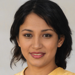 Joyful asian young-adult female with medium  brown hair and brown eyes