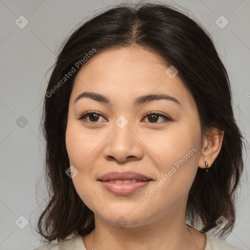 Joyful asian young-adult female with medium  brown hair and brown eyes