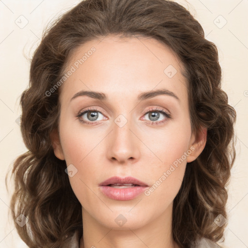 Neutral white young-adult female with long  brown hair and green eyes