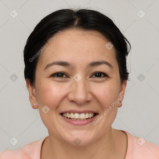 Joyful white adult female with short  brown hair and brown eyes