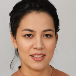 Joyful asian young-adult female with medium  brown hair and brown eyes