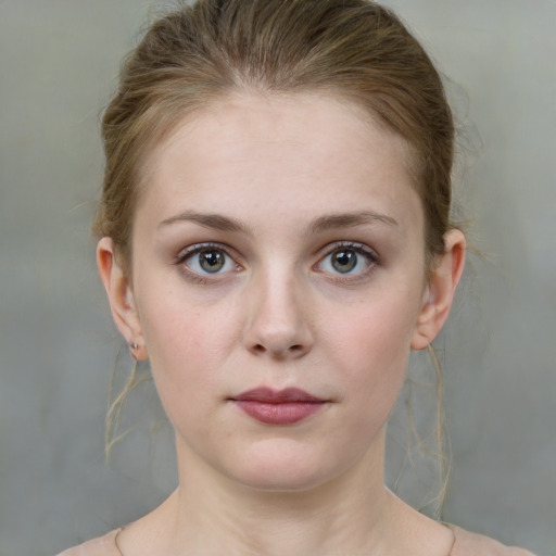 Neutral white young-adult female with medium  brown hair and grey eyes