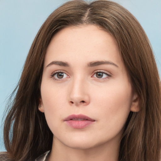 Neutral white young-adult female with long  brown hair and brown eyes