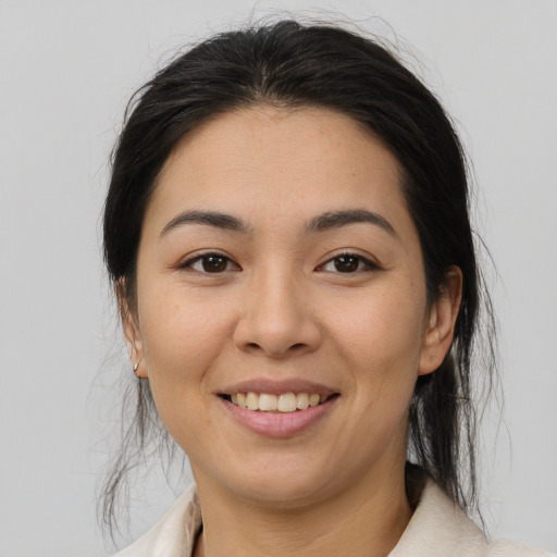 Joyful asian young-adult female with medium  brown hair and brown eyes