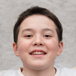 Joyful white child female with short  brown hair and brown eyes