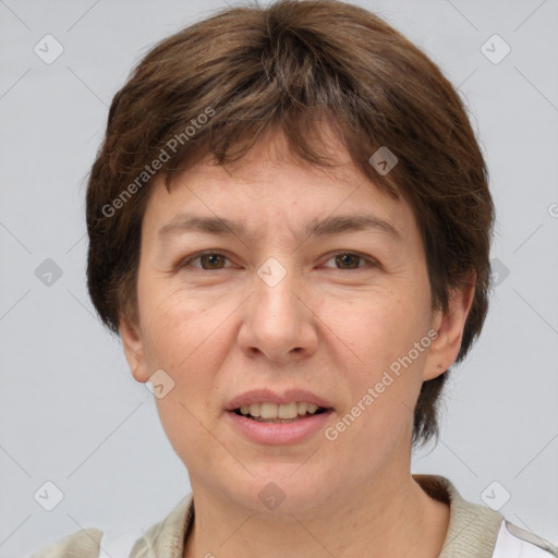 Joyful white adult female with short  brown hair and brown eyes