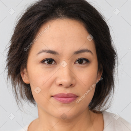 Joyful asian young-adult female with medium  brown hair and brown eyes