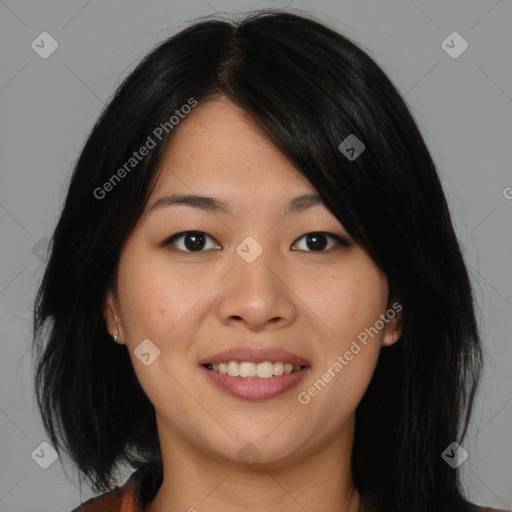 Joyful asian young-adult female with medium  black hair and brown eyes