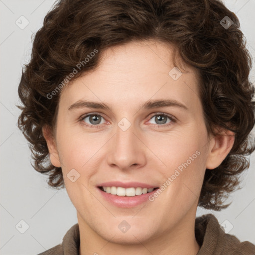 Joyful white young-adult female with medium  brown hair and green eyes