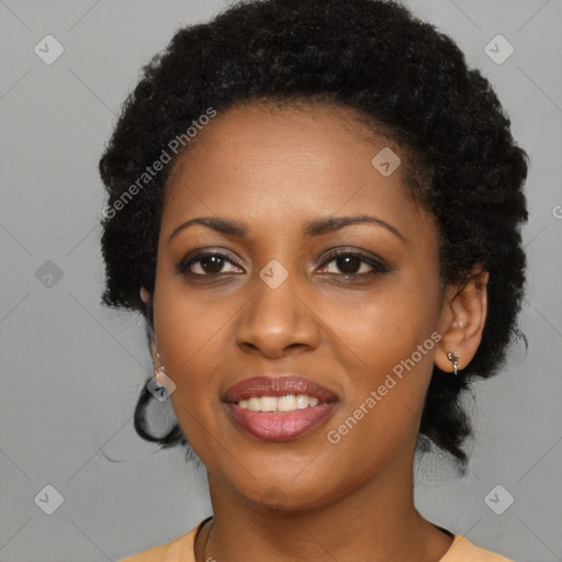 Joyful black young-adult female with medium  black hair and brown eyes