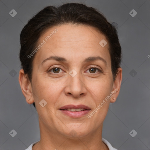 Joyful white adult female with short  brown hair and brown eyes