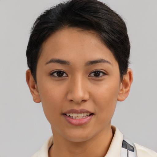 Joyful asian young-adult female with short  brown hair and brown eyes
