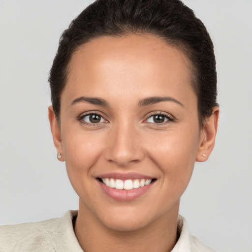 Joyful white young-adult female with short  brown hair and brown eyes