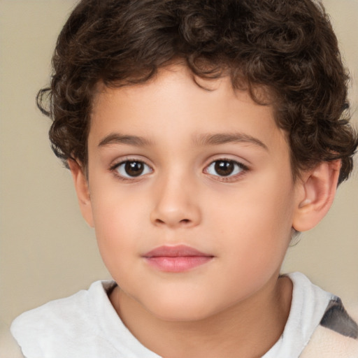 Joyful white child male with short  brown hair and brown eyes