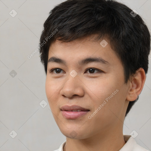 Joyful asian young-adult male with short  black hair and brown eyes