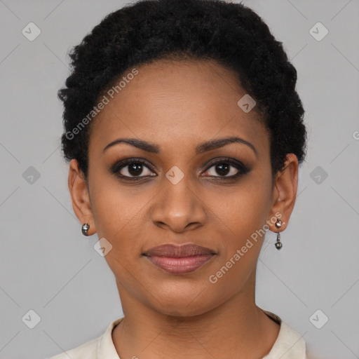 Joyful black young-adult female with short  black hair and brown eyes