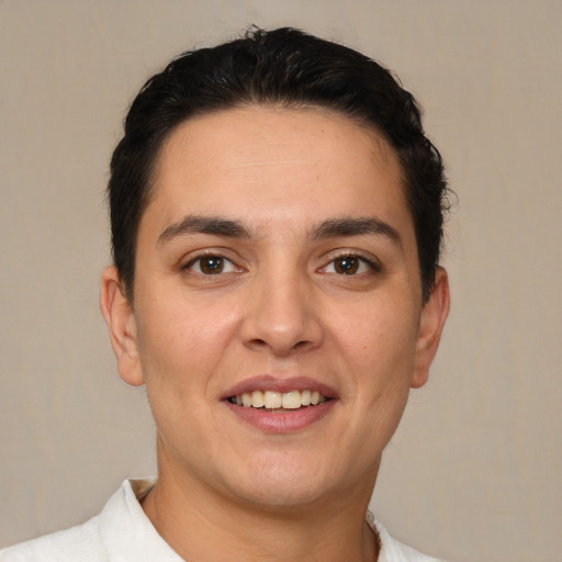 Joyful white young-adult male with short  brown hair and brown eyes