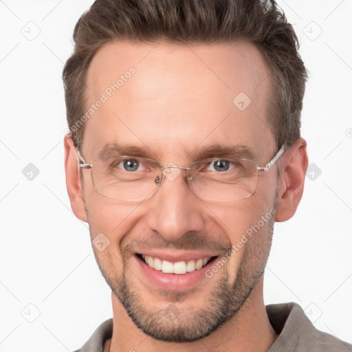 Joyful white adult male with short  brown hair and brown eyes