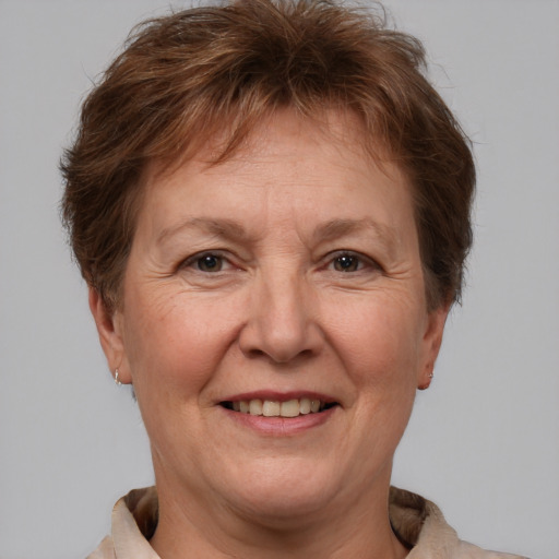 Joyful white middle-aged female with short  brown hair and brown eyes