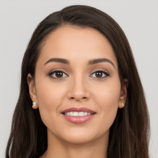 Joyful white young-adult female with long  brown hair and brown eyes