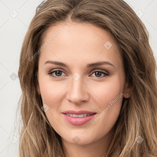 Joyful white young-adult female with long  brown hair and green eyes