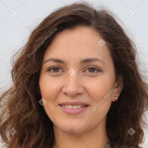 Joyful white adult female with long  brown hair and brown eyes