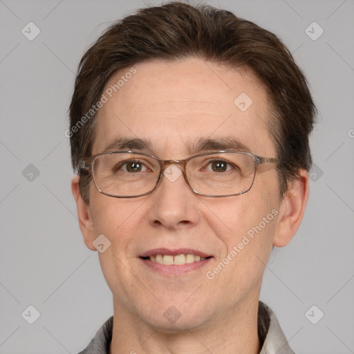 Joyful white adult male with short  brown hair and grey eyes