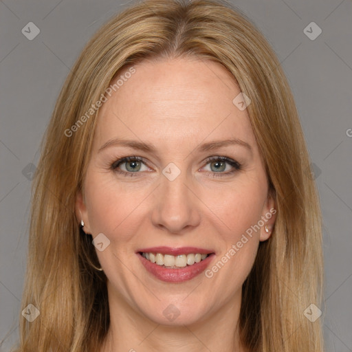 Joyful white adult female with long  brown hair and brown eyes