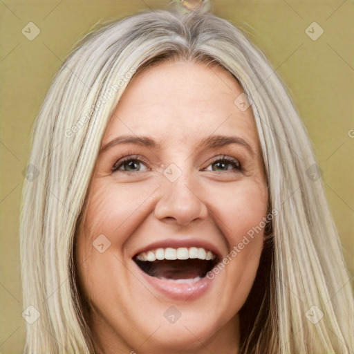 Joyful white adult female with long  brown hair and brown eyes