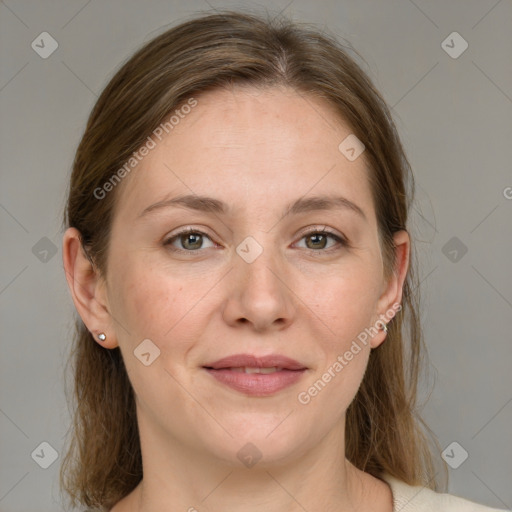 Joyful white adult female with medium  brown hair and grey eyes