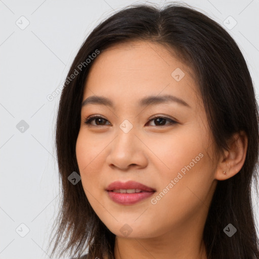 Joyful asian young-adult female with long  brown hair and brown eyes