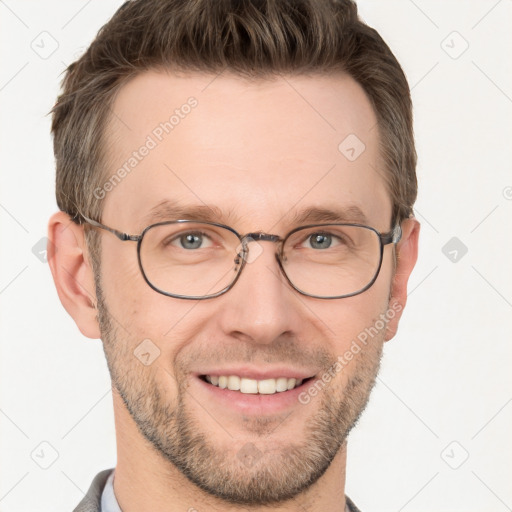 Joyful white adult male with short  brown hair and grey eyes