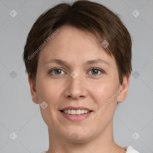 Joyful white young-adult female with short  brown hair and grey eyes