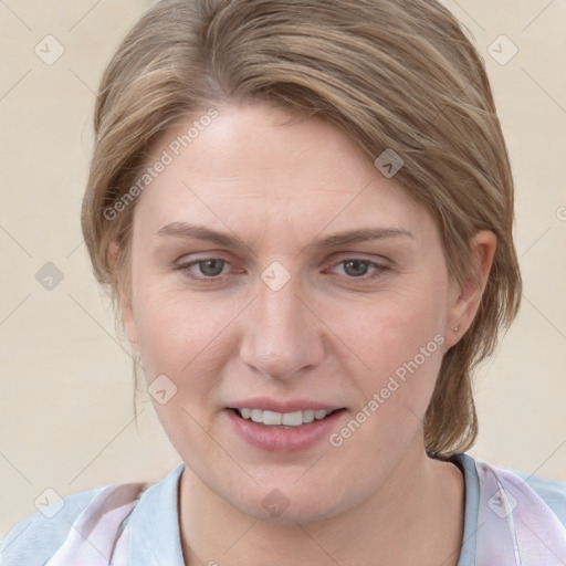 Joyful white young-adult female with medium  brown hair and blue eyes