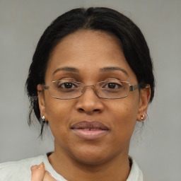 Joyful asian adult female with medium  brown hair and brown eyes