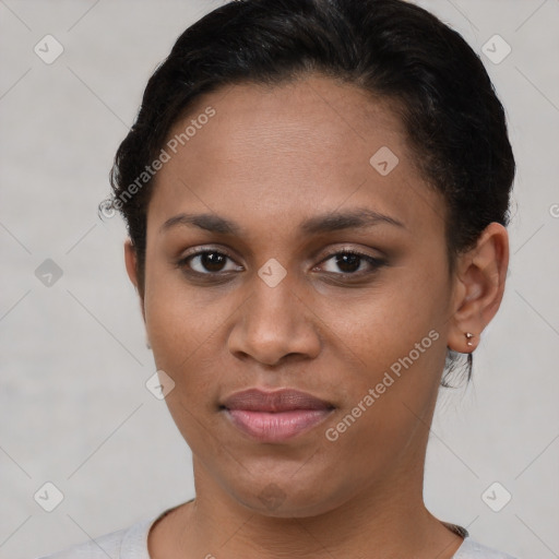 Joyful latino young-adult female with short  brown hair and brown eyes